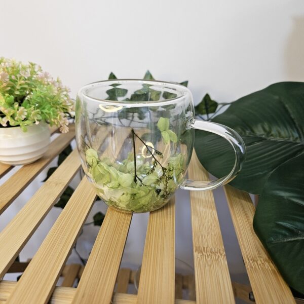 Glass Mug With Geen Flowers Inside
